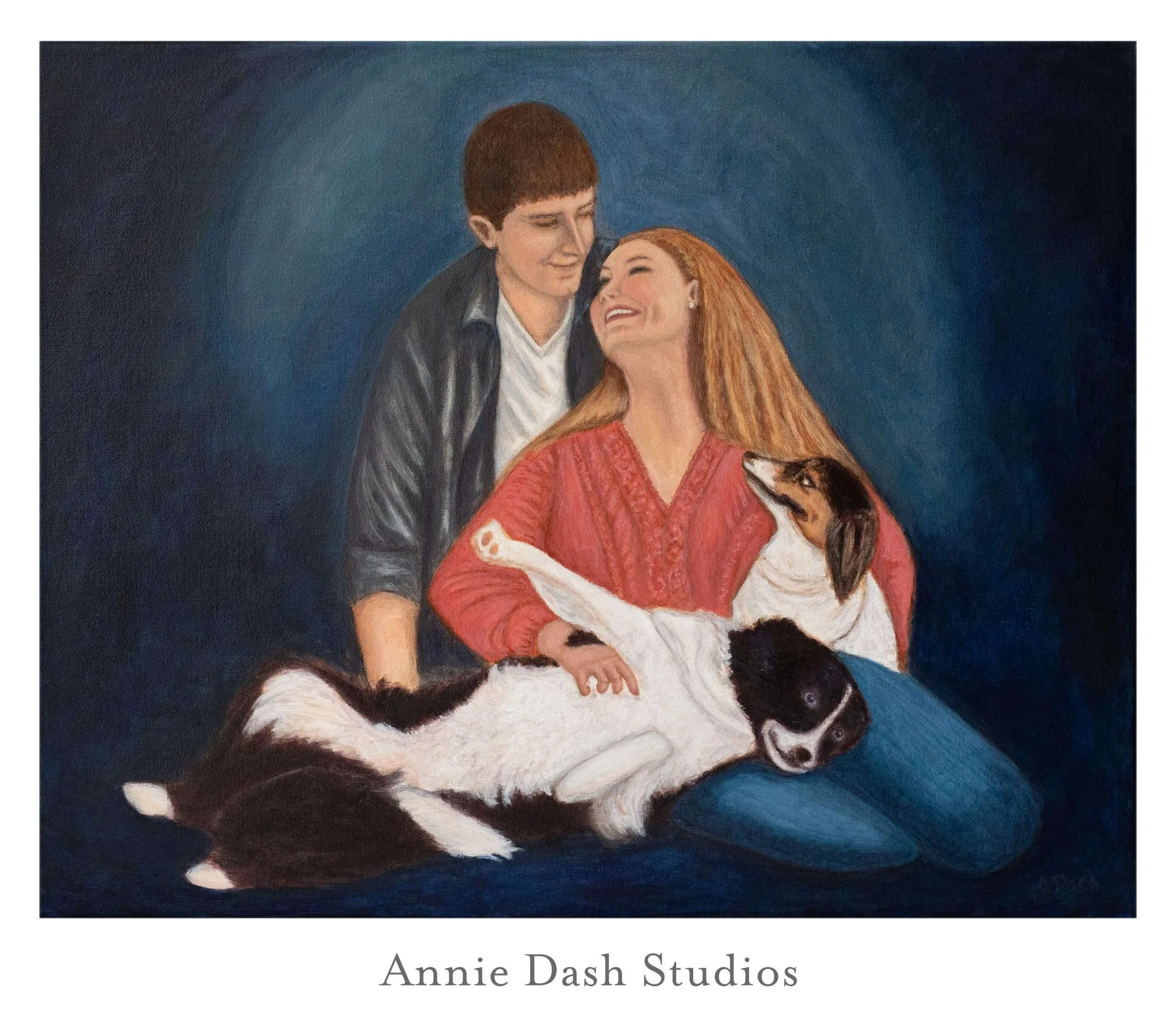 Family portrait of woman and man with two dogs